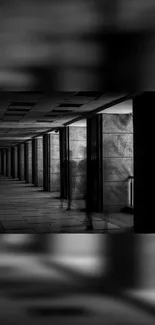 Shadowy figure in a black and white hallway.