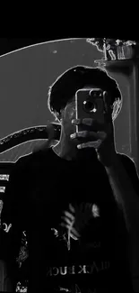 Monochrome mirror selfie with artistic flair.