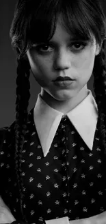 Monochrome portrait of a character with braided hair on a mobile wallpaper.