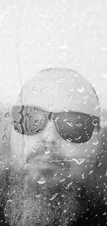 Monochrome wallpaper of a bearded man in sunglasses with raindrops.