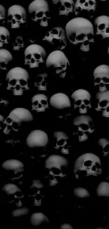 Monochrome skull wallpaper with black background.