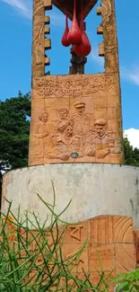 Rustic monument with blue sky background and greenery.