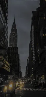 Moody city night view with towering buildings and bright streetlights.