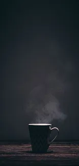 Moody coffee mug with steam on dark wooden background.