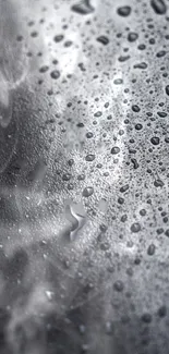 Moody gray wallpaper with water droplets on a textured surface.