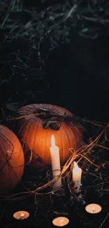 Moody Halloween wallpaper with pumpkins and candles glowing in the dark.