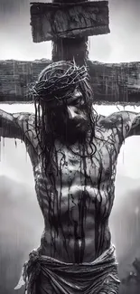 Black and white Jesus on cross with moody background.