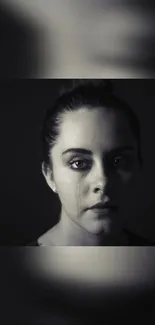 Moody monochrome portrait of a woman in black and white effect.