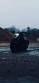 Moody motorcycle on a dark, rainy road.