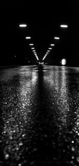 Moody night road with reflective wet street and glowing lights.