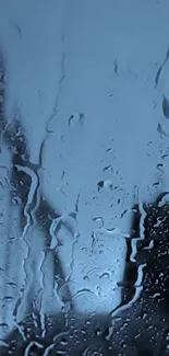 Rain-soaked glass with blue hue mobile wallpaper.