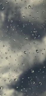 Moody sky with raindrops on glass wallpaper.