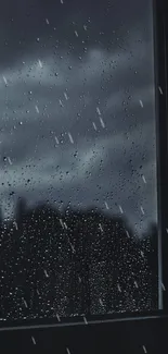 Dark rainy window with raindrops and stormy sky.