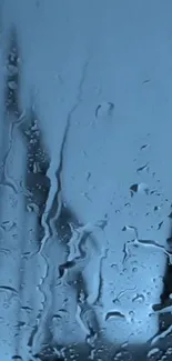 Moody blue rainy window wallpaper with water droplets