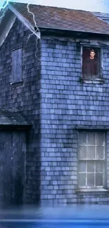 Old house with mysterious figure and stormy sky wallpaper