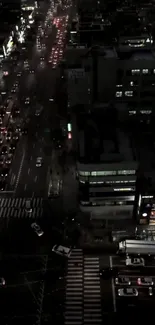 Nighttime urban street scene with city lights.