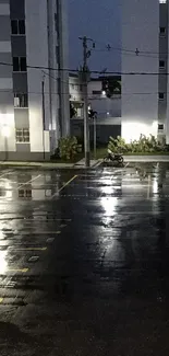 Moody urban nightscape with wet street reflections.