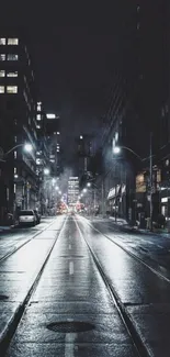 Moody urban street at night with city lights.