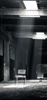 A solitary chair in a dimly lit, abandoned warehouse with beams of light.