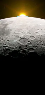 Moon's surface with sunrise glow, craters visible.