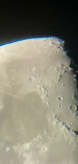 Gray-toned wallpaper featuring detailed view of the moon's surface and craters.