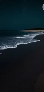 A serene moonlit beach with gentle waves at night.