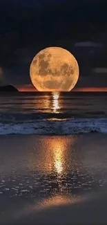 Full moon reflecting on beach waves at night.