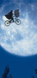 Silhouette of a bicycle flying across a glowing full moon at night.