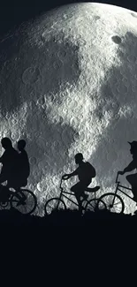 Cyclists silhouetted against a large, detailed moon in a serene night sky.