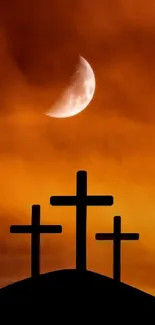 Silhouetted crosses under a moonlit, orange sky.