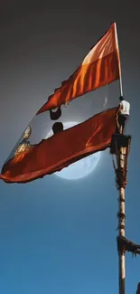 Flag waving against a luminous moonlit night sky.