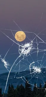 Moon over forest with cracked glass effect wallpaper.