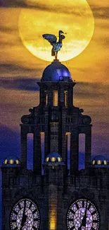 Moonlit clock tower with full moon background.