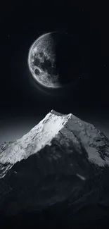 Moonlit mountain peak under a starry night sky.