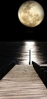 A wooden dock under a full moon on a calm night.