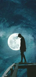 Silhouette of a person against a bright full moon in a dark, starry sky.