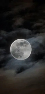 Full moon in a dark, cloudy night sky wallpaper.