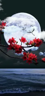 Moonlit night with red blossoms over ocean.