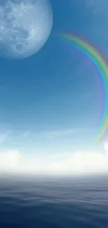 Moonlit ocean with a vibrant rainbow crossing the sky.