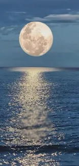 Full moon reflecting over a peaceful ocean at night.