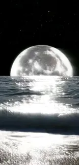 Full moon reflecting on the ocean's surface with a serene, starry background.