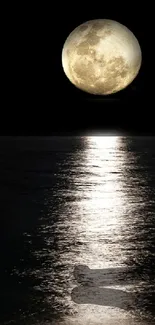 Majestic moonlit ocean night wallpaper with reflection on water.