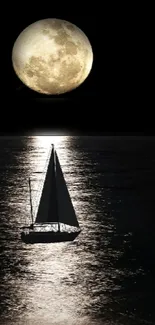 Sailboat gliding under a full moon on dark ocean at night.