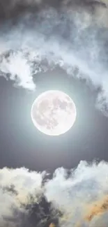 A full moon shining through clouds in a night sky, creating a tranquil scene.