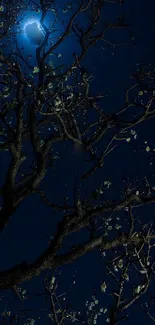 Silhouetted tree with moonlit night sky wallpaper.