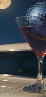 Surreal wallpaper with moonlit wine glass and geometric orb.