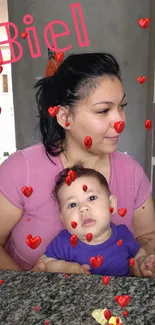 Mother holding baby in a home kitchen setting.