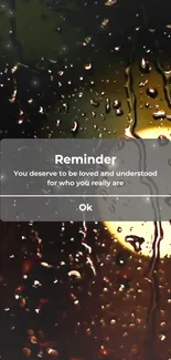 Raindrop wallpaper with motivational reminder on a phone screen.