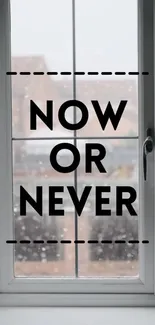 Motivational quote 'Now or Never' on a window view background.