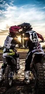 Motocross riders at sunset sharing a thrilling adventure.